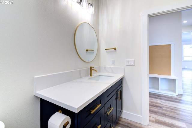 bathroom featuring vanity and hardwood / wood-style flooring