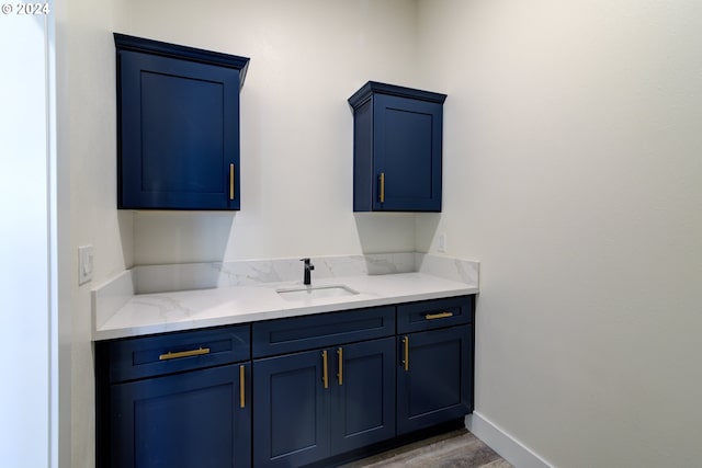 bathroom featuring wood-type flooring and vanity