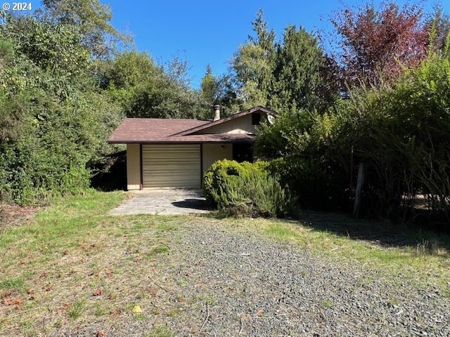 view of property exterior with a garage