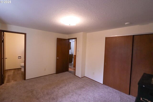 full bathroom with vanity, toilet, hardwood / wood-style flooring, and shower / bath combination with glass door