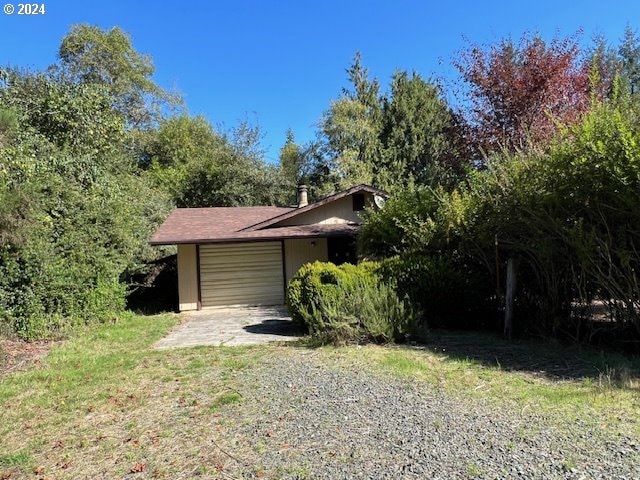 view of property exterior with a garage