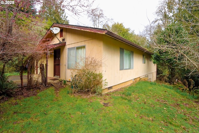 view of home's exterior featuring a lawn