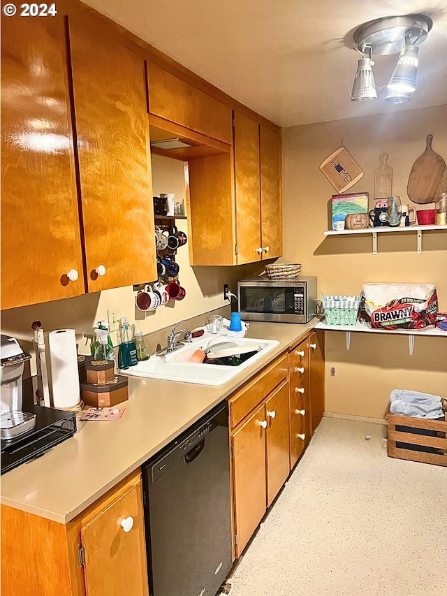 kitchen with sink and appliances with stainless steel finishes