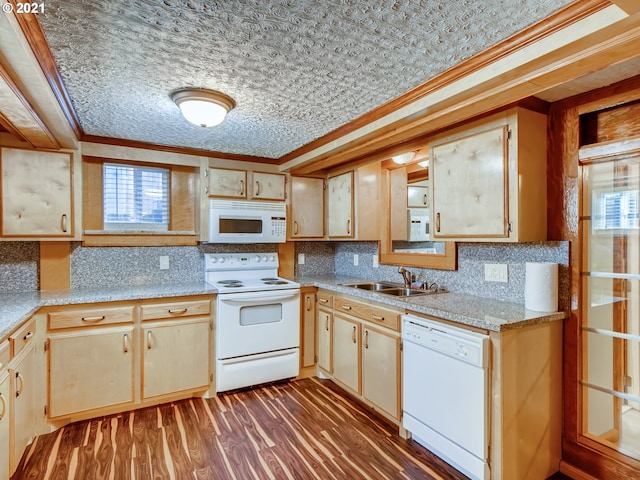 kitchen with tasteful backsplash, white appliances, dark wood-type flooring, crown molding, and sink