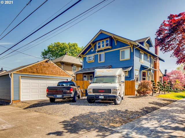 front facade with an outbuilding and a garage