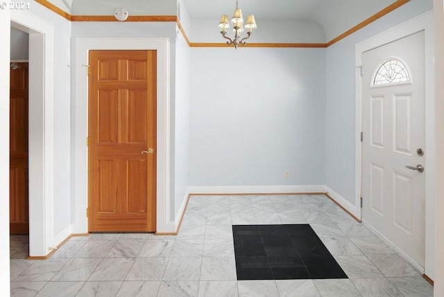 entrance foyer with a chandelier