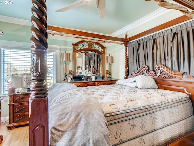 bedroom with crown molding and light hardwood / wood-style flooring