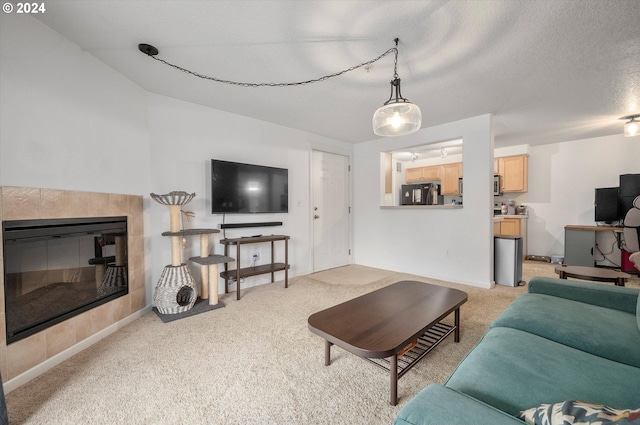 living room with a fireplace, a textured ceiling, and light carpet