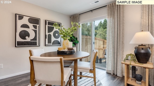 dining area featuring dark hardwood / wood-style floors