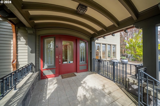 view of exterior entry featuring french doors