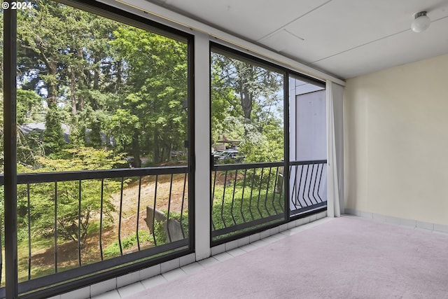 unfurnished sunroom with plenty of natural light