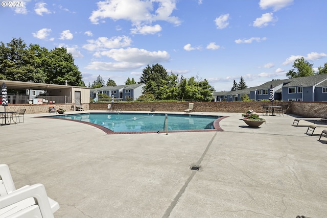 view of swimming pool with a patio area