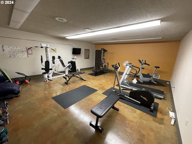 workout area with a textured ceiling