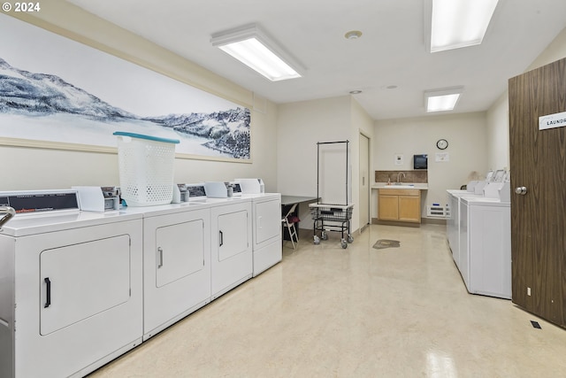 laundry area featuring washer and dryer and sink