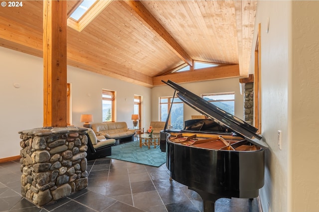 misc room with wooden ceiling, a fireplace, dark tile floors, and lofted ceiling with skylight