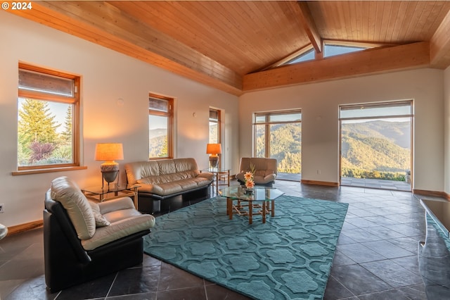 tiled living room featuring beam ceiling, high vaulted ceiling, a mountain view, and wooden ceiling