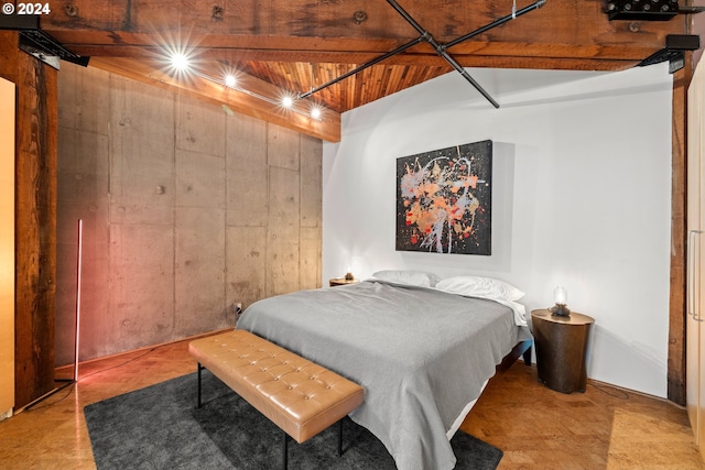 bedroom with wood ceiling, beamed ceiling, and wooden walls