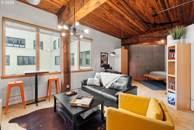 living room with ceiling fan with notable chandelier, beamed ceiling, and wood ceiling