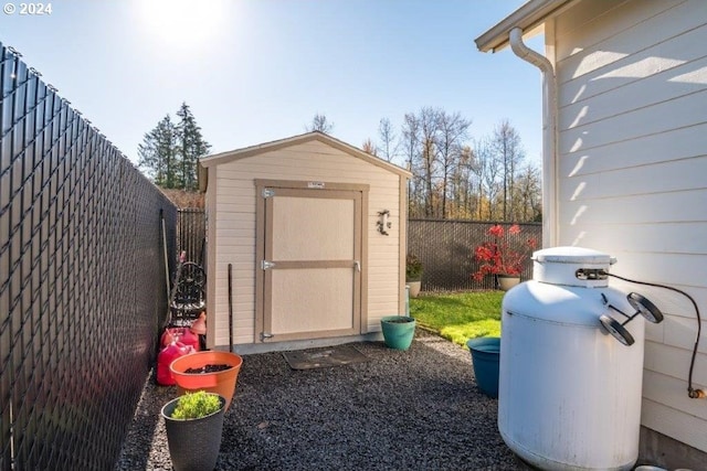 view of shed featuring a fenced backyard