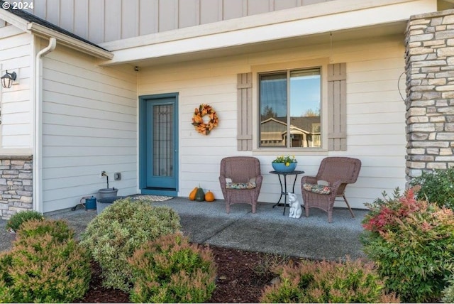 view of exterior entry with board and batten siding