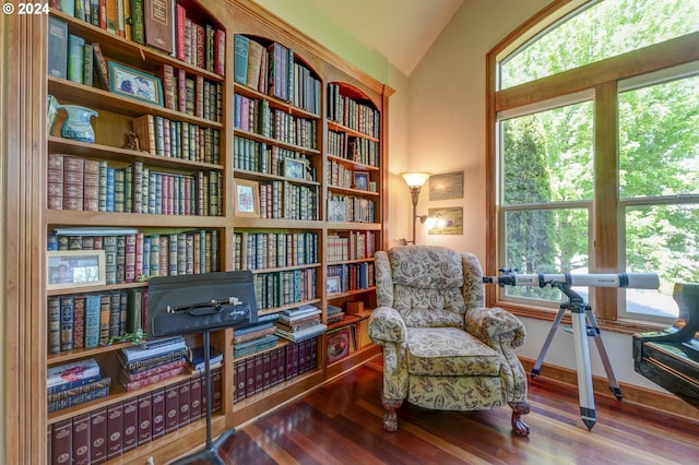 sitting room with wood-type flooring and vaulted ceiling