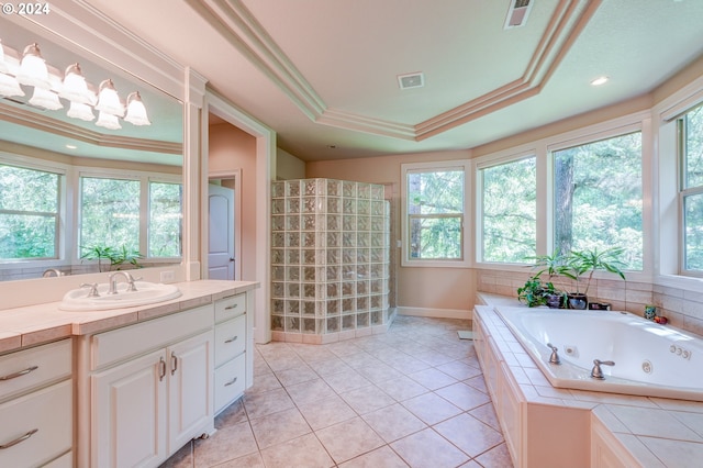 bathroom featuring a healthy amount of sunlight, tile patterned floors, a raised ceiling, and ornamental molding