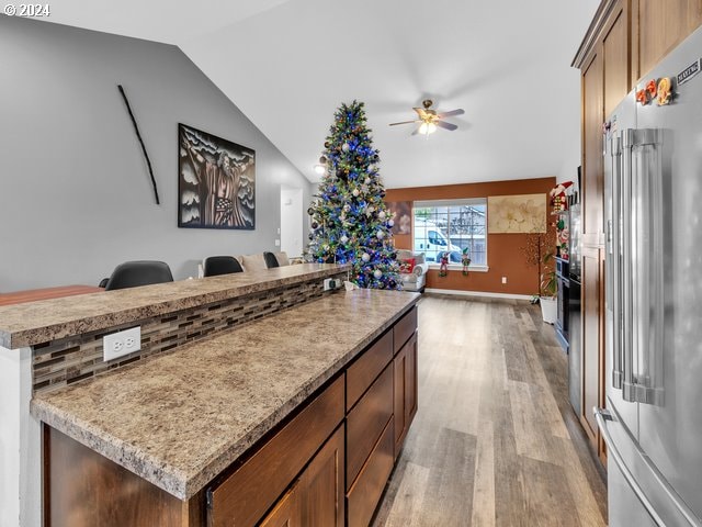 566 N 11th St, Aumsville, OR 97325 - kitchen featuring high quality fridge, open floor plan, light wood-type flooring, ceiling fan, and lofted ceiling