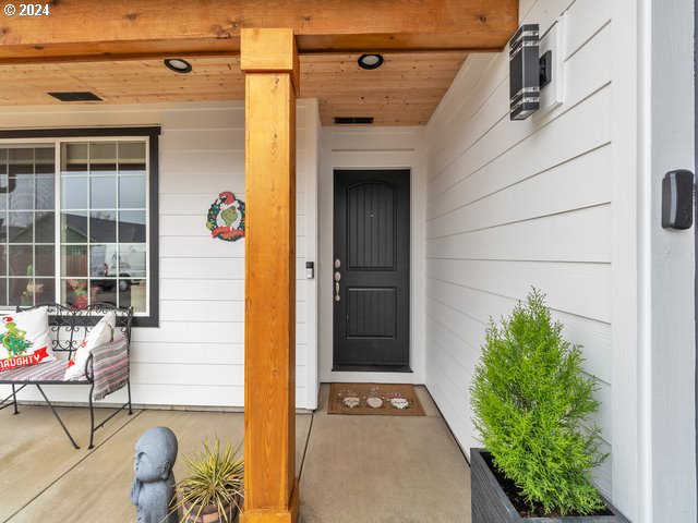 566 N 11th St, Aumsville, OR 97325 - doorway to property featuring covered porch