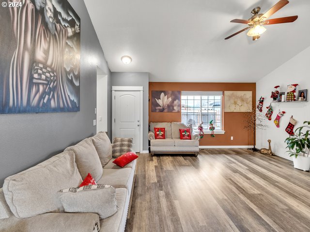 566 N 11th St, Aumsville, OR 97325 - living area with ceiling fan, wood finished floors, and baseboards