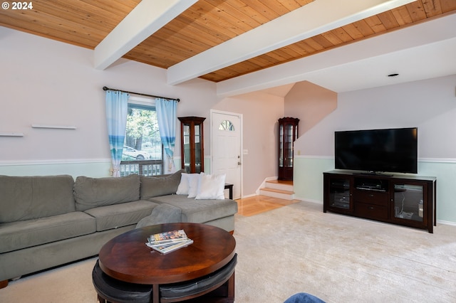 living room featuring beam ceiling, light carpet, and wood ceiling