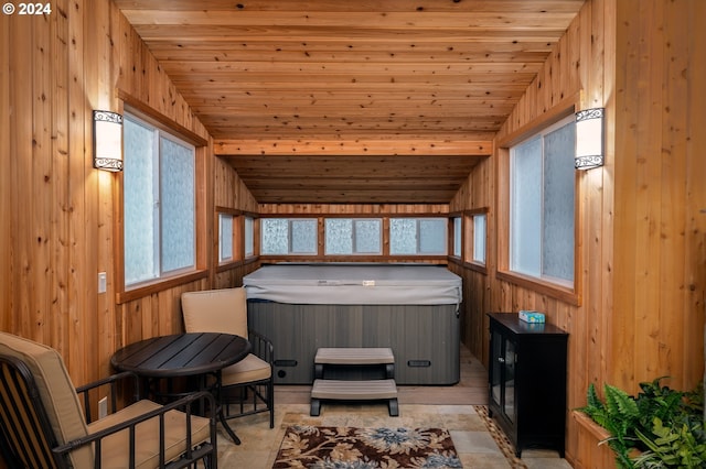 sunroom featuring a wealth of natural light, wood ceiling, a jacuzzi, and lofted ceiling