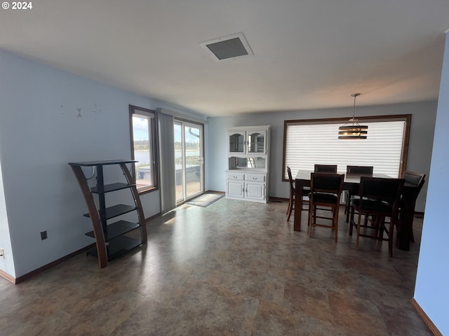 dining room featuring visible vents and baseboards