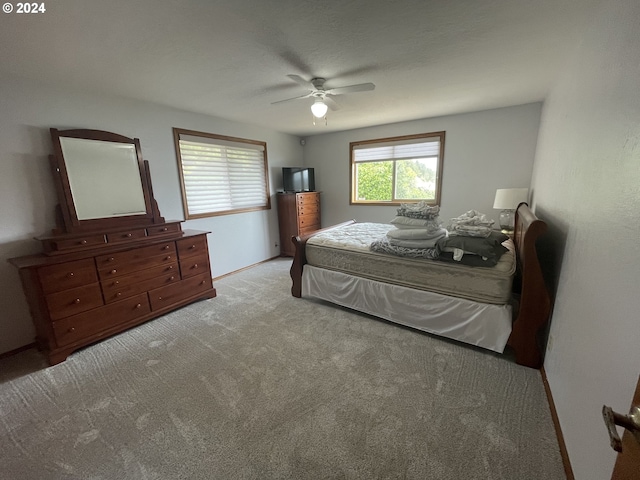 bedroom with light colored carpet and ceiling fan