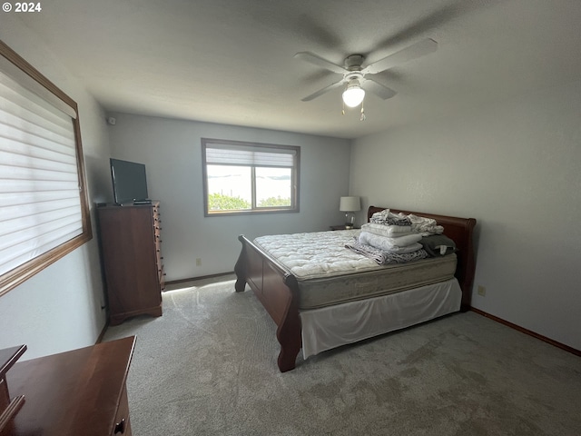 bedroom with carpet flooring, ceiling fan, and baseboards