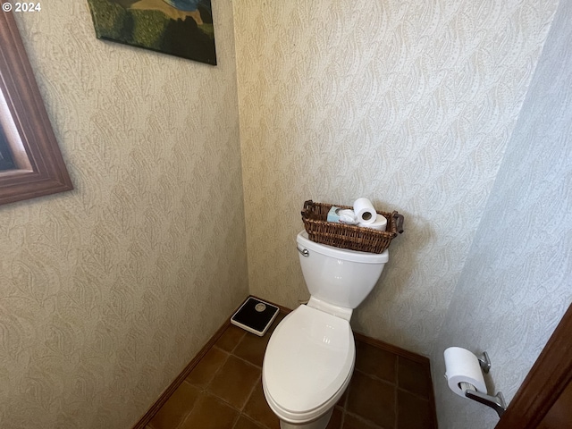 bathroom with tile patterned floors and toilet