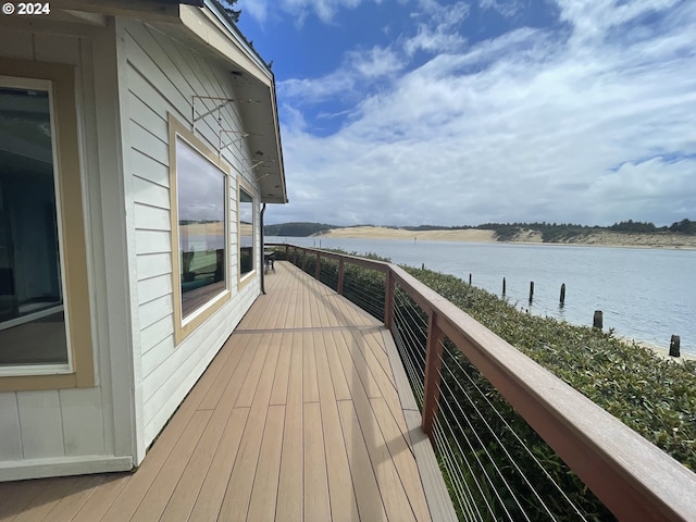 wooden terrace with a water view