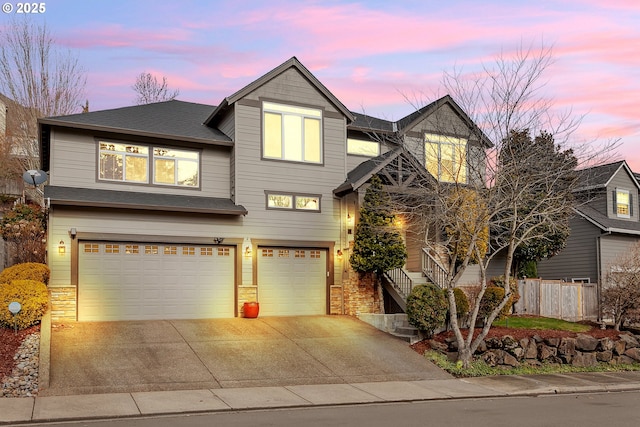 view of front of house featuring a garage, fence, driveway, stairway, and roof with shingles