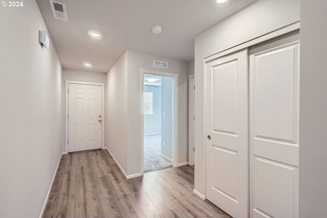 hallway featuring light wood-type flooring