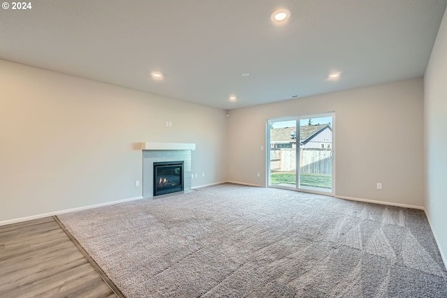 unfurnished living room with hardwood / wood-style floors