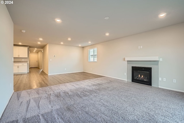 unfurnished living room featuring light hardwood / wood-style floors