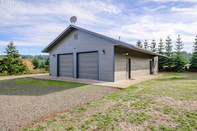 garage with a yard