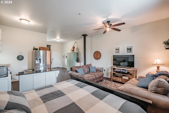 interior space featuring stainless steel fridge with ice dispenser and ceiling fan