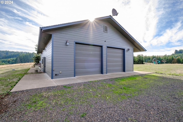 garage featuring a yard