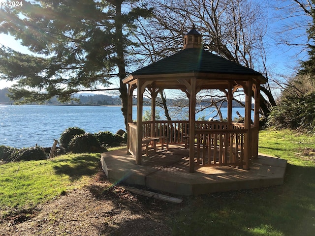 exterior space featuring a gazebo and a water view