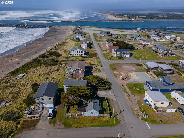 bird's eye view with a view of the beach and a water view