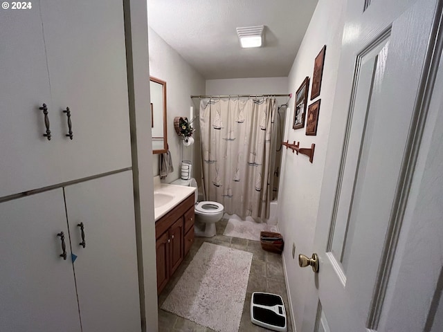 full bathroom with vanity, shower / bath combination with curtain, and toilet