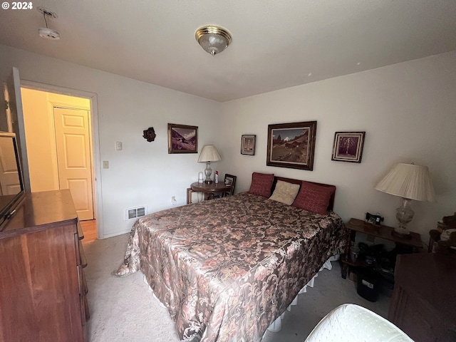 bedroom featuring light carpet