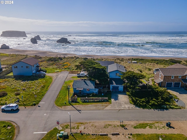 aerial view with a water view and a beach view