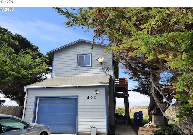 view of side of home featuring a garage