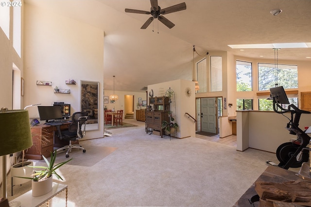 office space featuring light carpet, high vaulted ceiling, and a ceiling fan